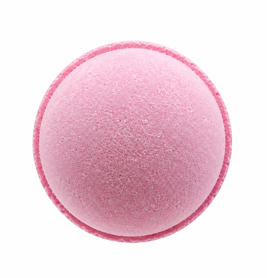A round pink bath bomb, (or an uncolored option is available), scented with scents of florals, musk, and fruity notes. 